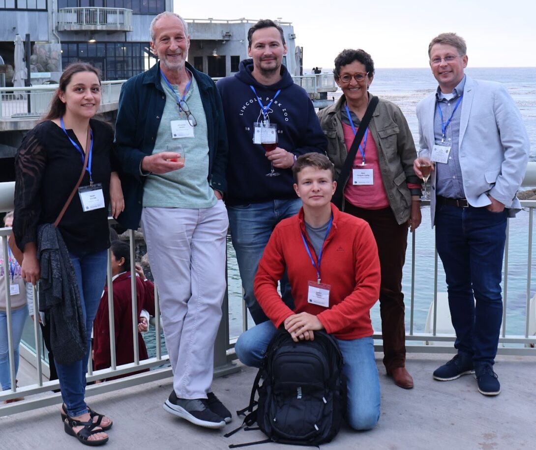 Members of the lab take a photo together at the conference in Pacific Grove